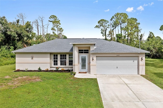 view of front of property with a garage and a front yard