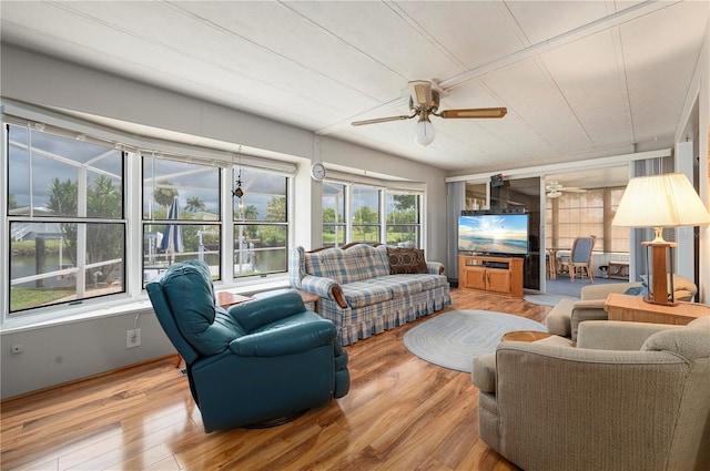 living room featuring hardwood / wood-style flooring and ceiling fan