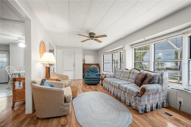 living area featuring wood finished floors and a ceiling fan