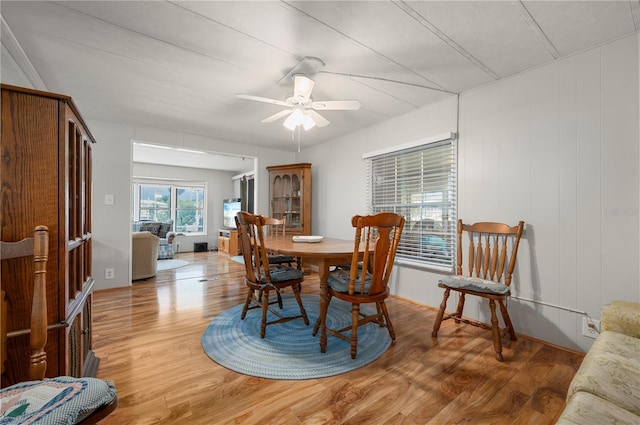 dining space featuring light wood-type flooring and ceiling fan