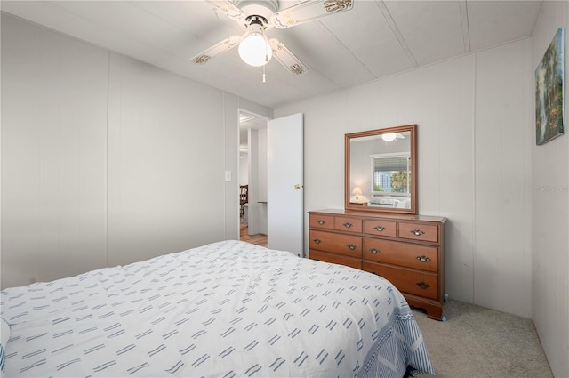 bedroom with light colored carpet and ceiling fan