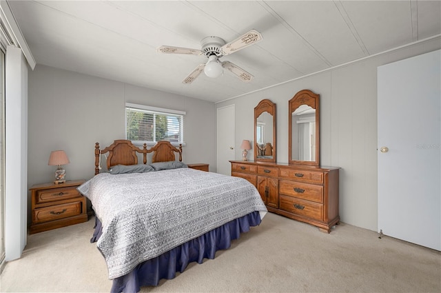 bedroom with light colored carpet and ceiling fan