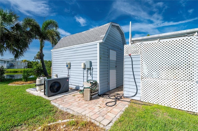 view of outbuilding with a lawn