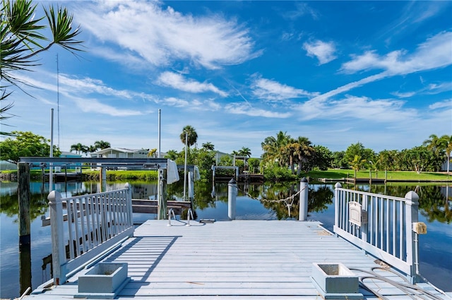 view of dock featuring a water view and boat lift