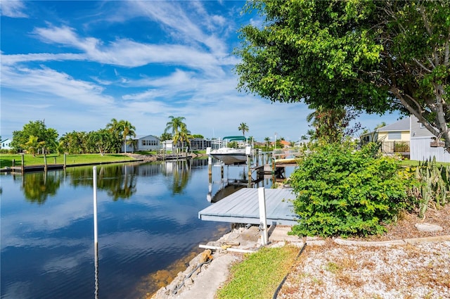 view of dock featuring a water view and boat lift