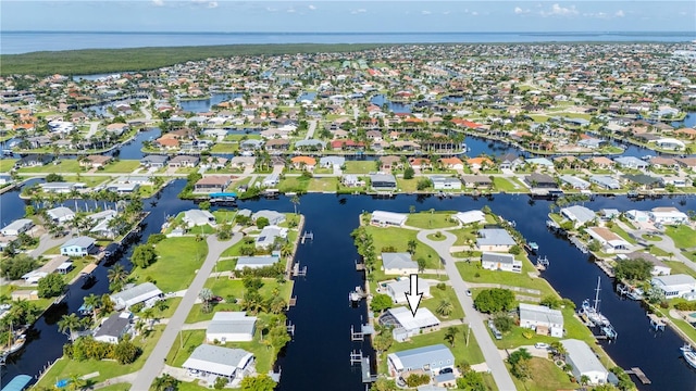 bird's eye view with a residential view and a water view