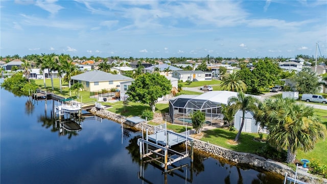 bird's eye view featuring a water view and a residential view