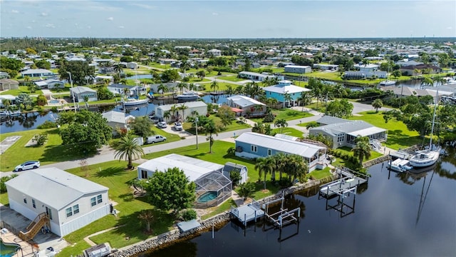 aerial view with a water view and a residential view