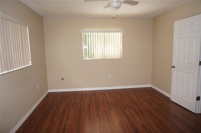 spare room with wood-type flooring, a textured ceiling, and ceiling fan