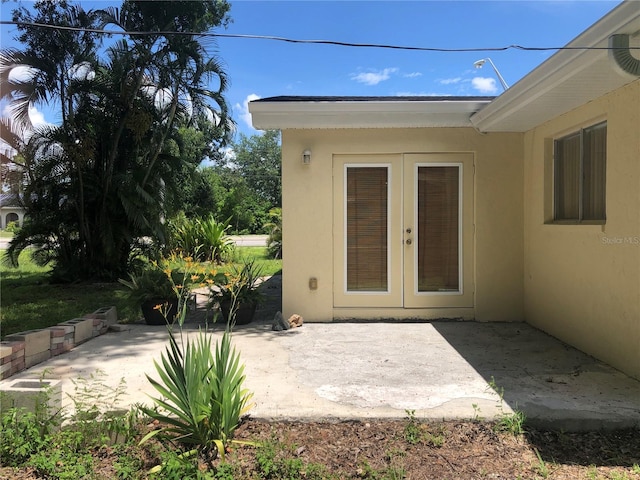 entrance to property with a patio area