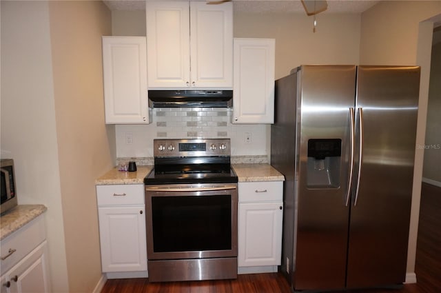 kitchen with white cabinetry, dark hardwood / wood-style floors, backsplash, and appliances with stainless steel finishes