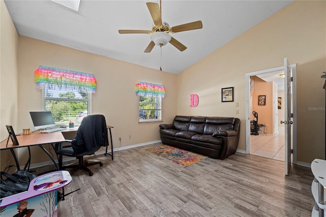 home office featuring a healthy amount of sunlight, light hardwood / wood-style floors, and ceiling fan