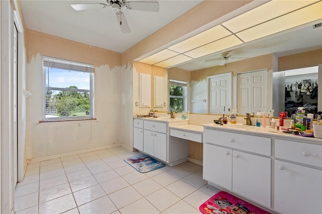 bathroom featuring ceiling fan, dual bowl vanity, and tile patterned flooring