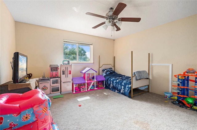 carpeted bedroom featuring ceiling fan