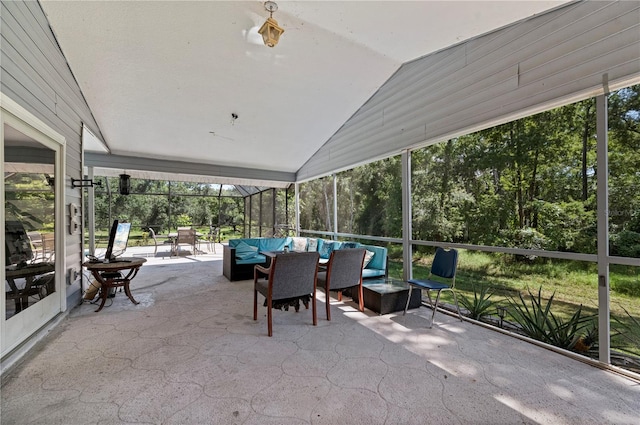 sunroom with lofted ceiling and plenty of natural light