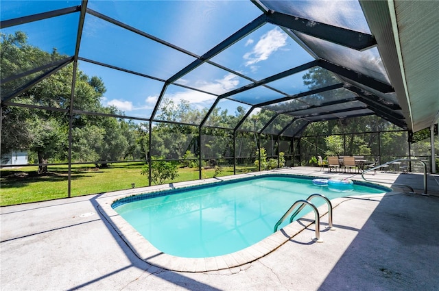 view of pool featuring a patio area, a lawn, and glass enclosure