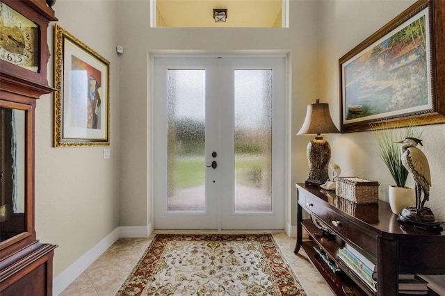 tiled entrance foyer featuring french doors