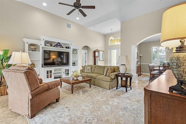 3327 Surfside Blvd, Cape Coral, FL 33914 - living area featuring tile patterned floors, a ceiling fan, arched walkways, and high vaulted ceiling