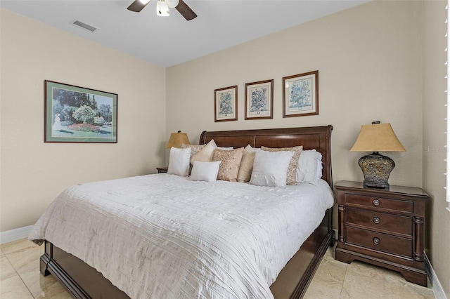 tiled bedroom with ceiling fan