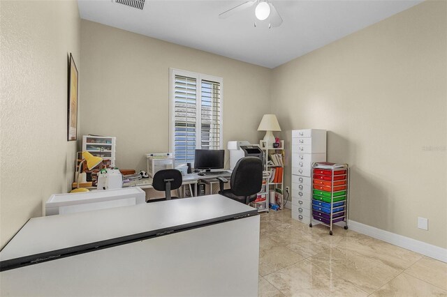 home office featuring light tile patterned floors and ceiling fan