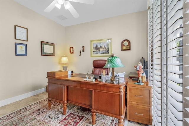 tiled home office with ceiling fan