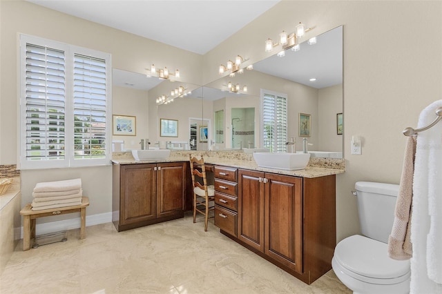 bathroom featuring dual vanity, tile patterned floors, and toilet