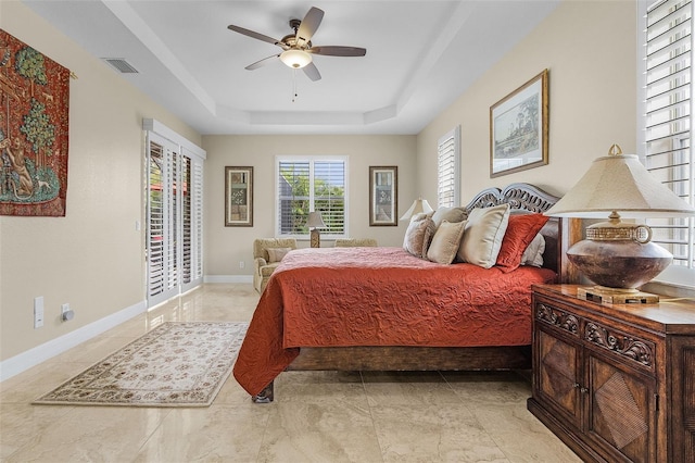 3327 Surfside Blvd, Cape Coral, FL 33914 - bedroom with visible vents, a ceiling fan, baseboards, a raised ceiling, and access to exterior