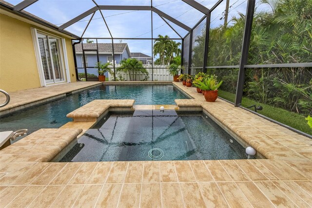 view of swimming pool with an in ground hot tub and glass enclosure