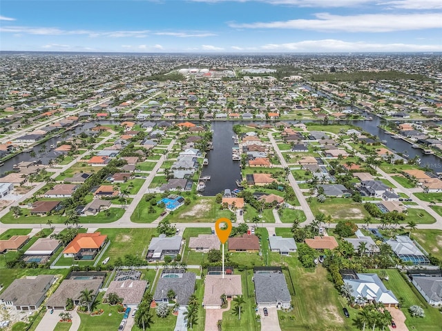 3327 Surfside Blvd, Cape Coral, FL 33914 - birds eye view of property with a residential view and a water view