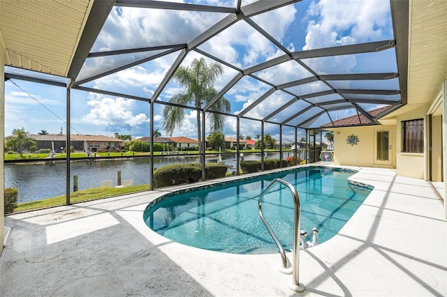 view of swimming pool with glass enclosure, a water view, and a patio