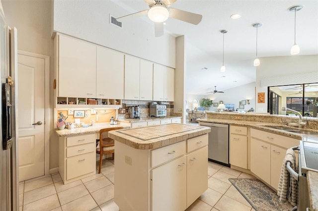 kitchen featuring a center island, hanging light fixtures, stainless steel dishwasher, sink, and vaulted ceiling