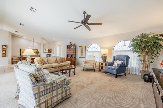 living room with light carpet, ceiling fan, and lofted ceiling