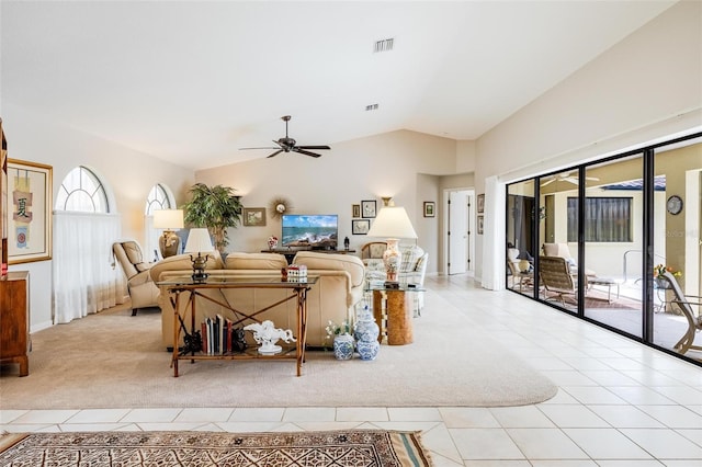 tiled living room with vaulted ceiling and ceiling fan