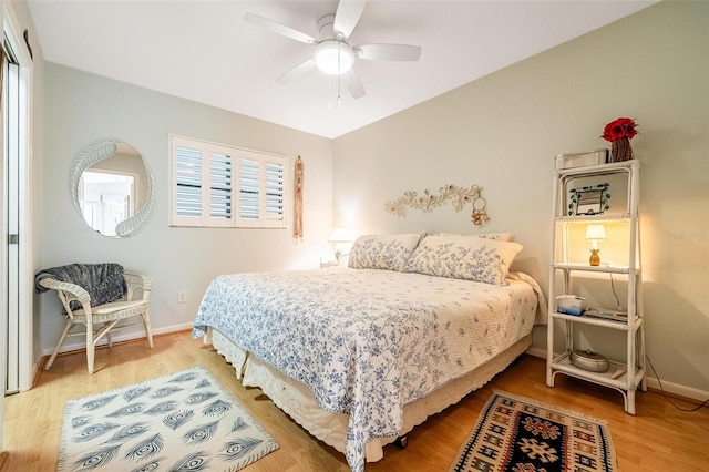 bedroom featuring ceiling fan and hardwood / wood-style flooring