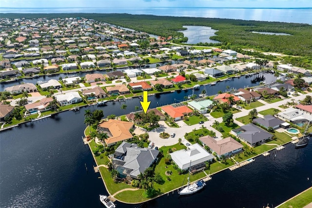 birds eye view of property featuring a residential view and a water view