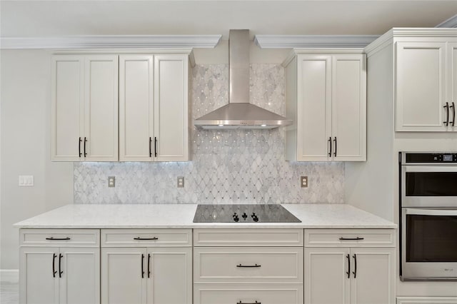 kitchen featuring backsplash, double oven, black electric cooktop, and wall chimney range hood