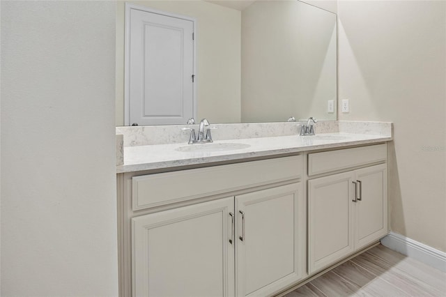 bathroom with dual bowl vanity