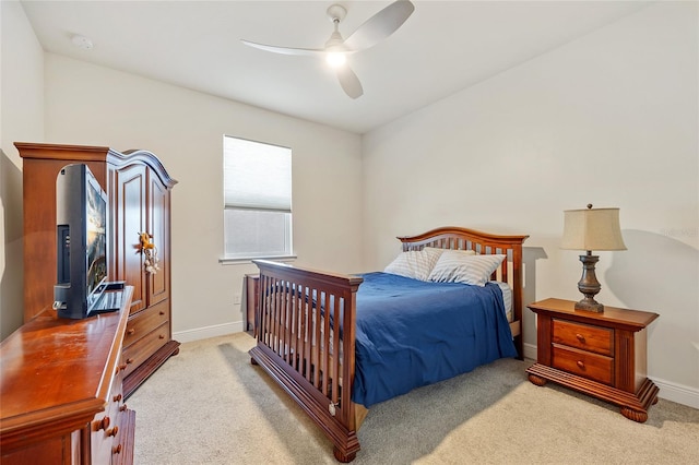 bedroom with light colored carpet and ceiling fan