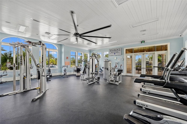 workout area with french doors and ceiling fan