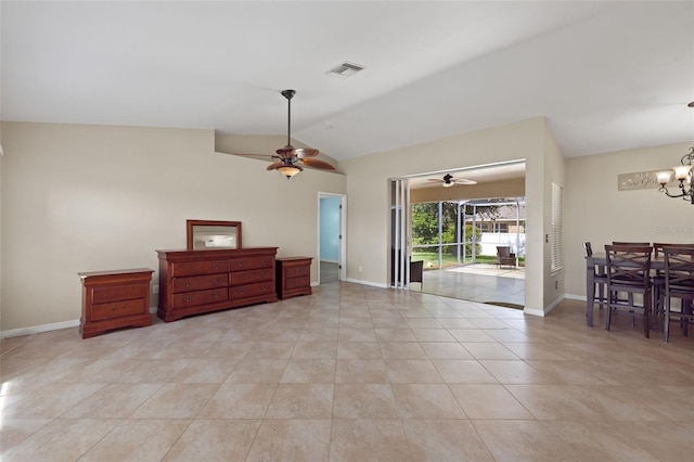 interior space with ceiling fan with notable chandelier and lofted ceiling