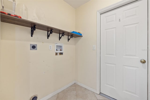 washroom featuring hookup for a washing machine, electric dryer hookup, and light tile patterned floors