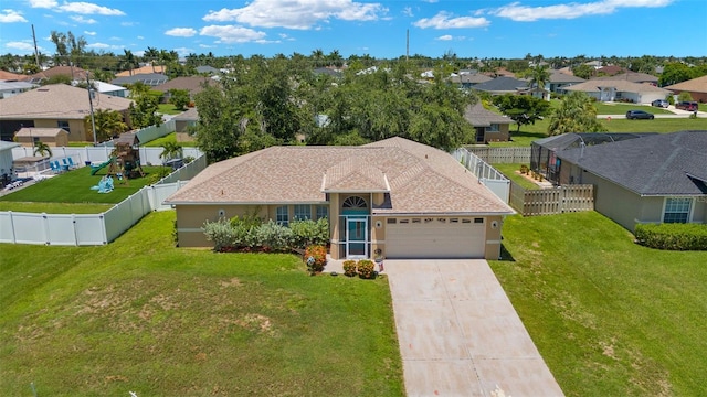 exterior space with a garage and a front lawn