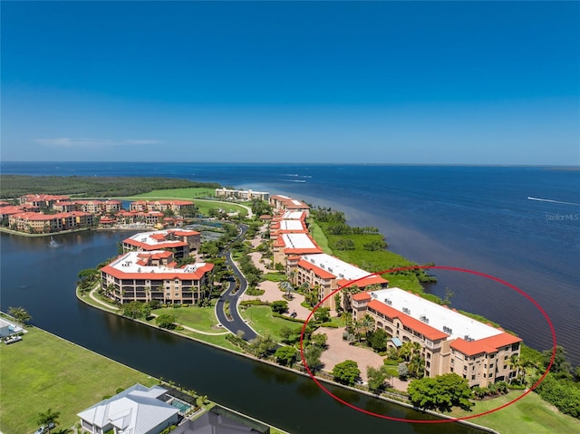 birds eye view of property featuring a water view