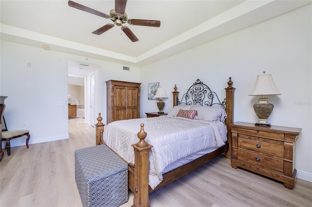 bedroom with light hardwood / wood-style flooring and ceiling fan