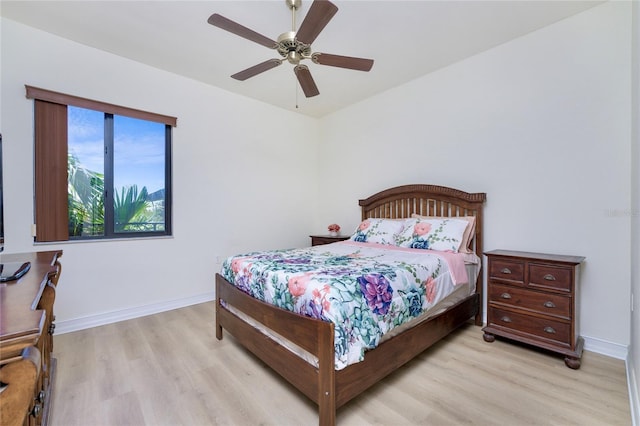 bedroom featuring ceiling fan and light hardwood / wood-style floors