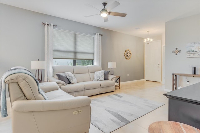 living room with ceiling fan with notable chandelier