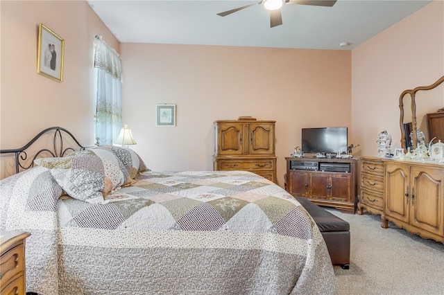 bedroom with light carpet and ceiling fan