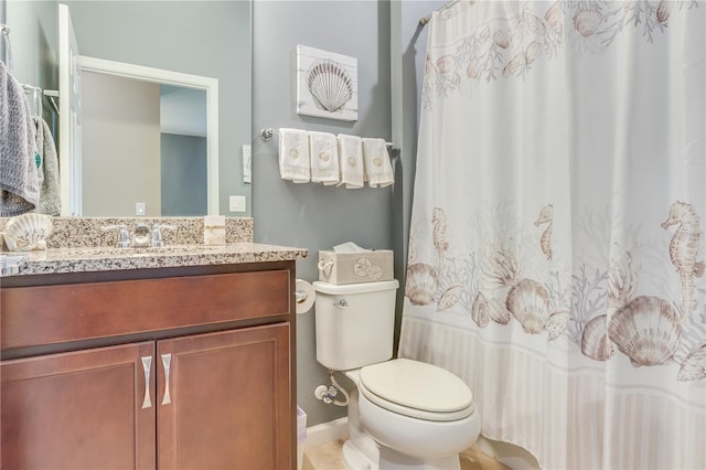 bathroom with toilet and vanity