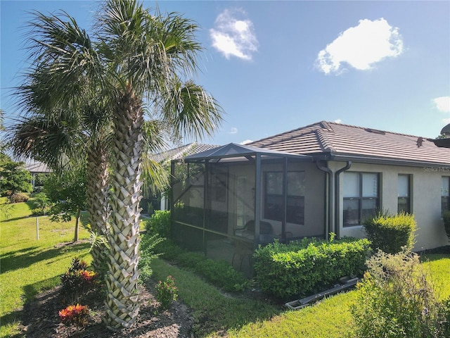 view of side of property with a yard