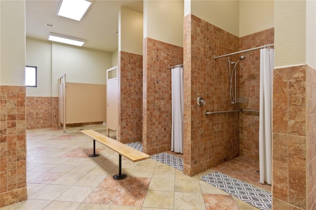 bathroom featuring tile patterned floors and a shower with curtain